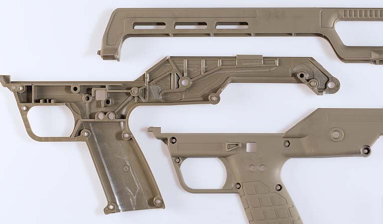 Plastic molded firearms components